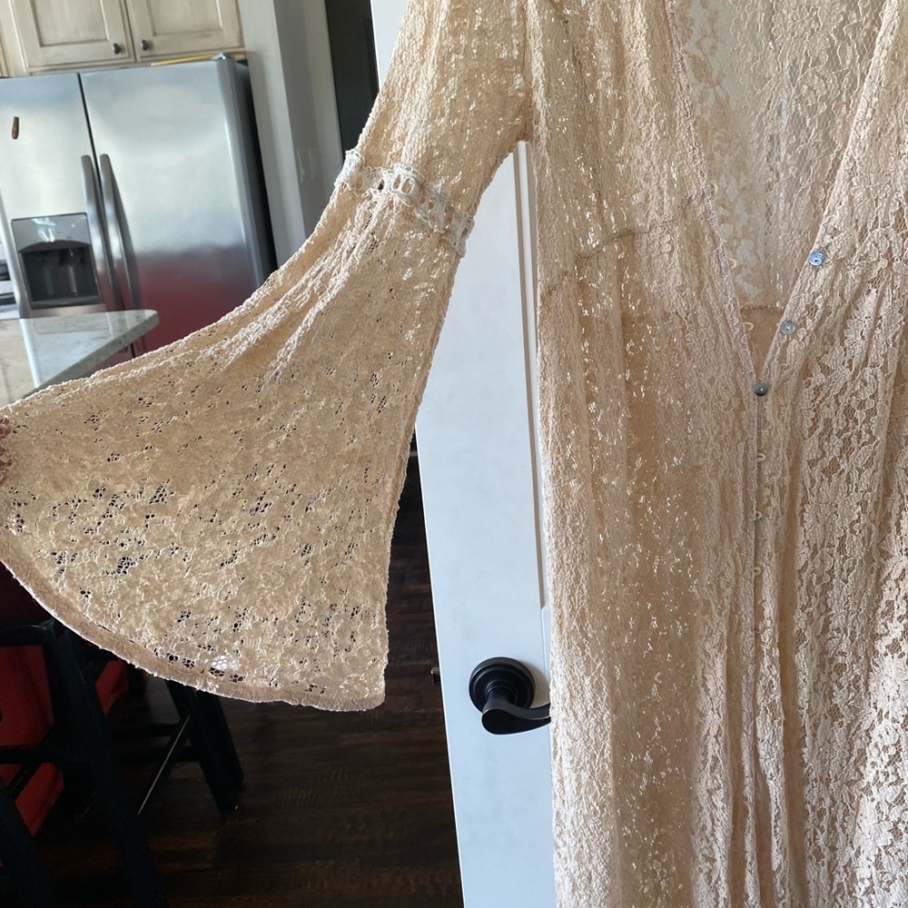 Never worn.  Lace duster